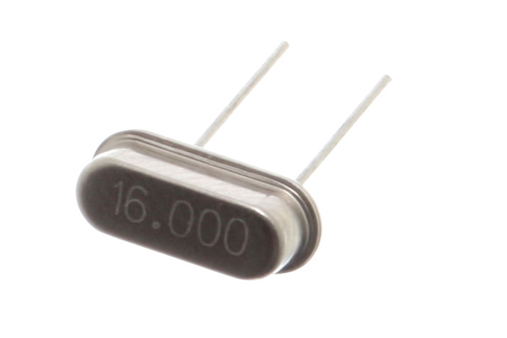 A miniature 16 MHz quartz crystal enclosed in a hermetically sealed HC-49/S package, used as the resonator in a crystal oscillator.